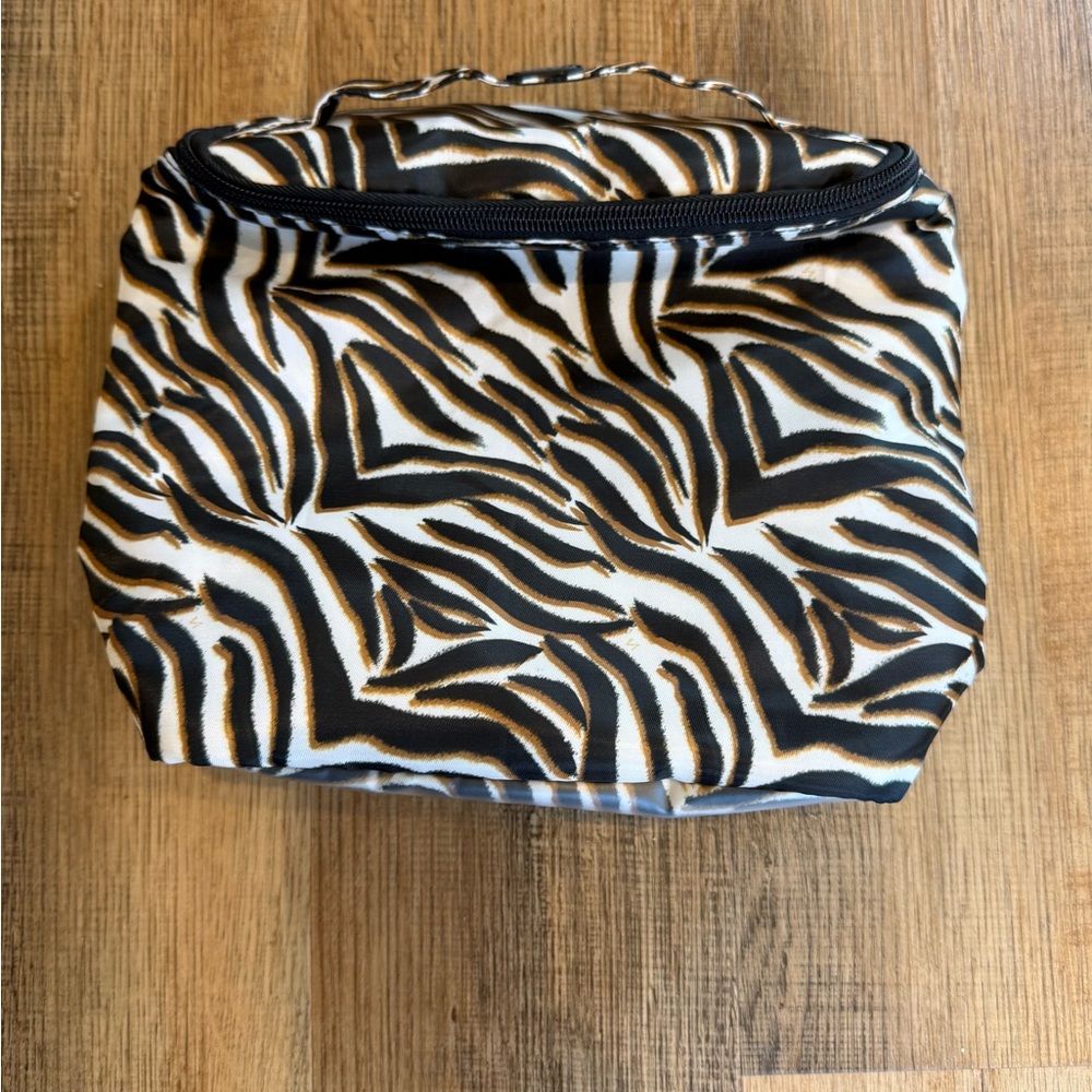 lug Zebra-Print Cosmetic Bag in Black, White & Brown tropical interior zipper